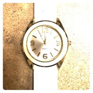 Very causal white and gold watch.